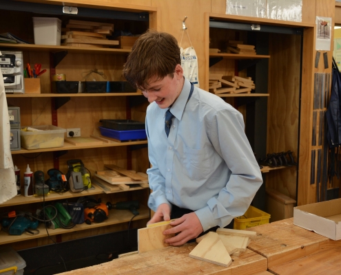 Student sanding timber project