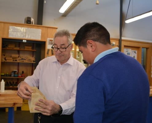Wood work teacher with student